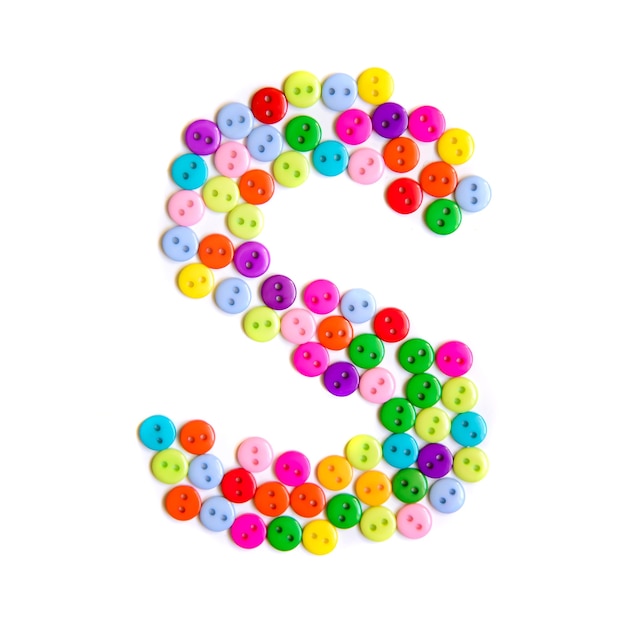 Letter S of the English alphabet from a group of colorful small buttons on white 