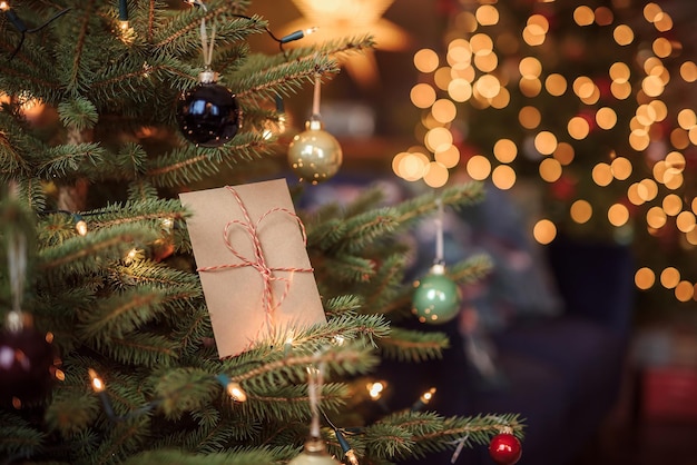 Photo letter to santa left in the branches of christmas tree christmas decor christmas concept