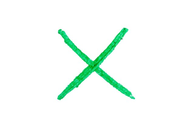 Photo letter x drawn with green crayon on white background