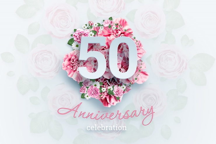 Photo lettering 50 numbers and anniversary celebration text on pink flowers.