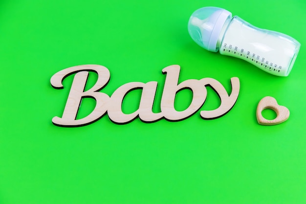 Photo lettering baby on a green surface