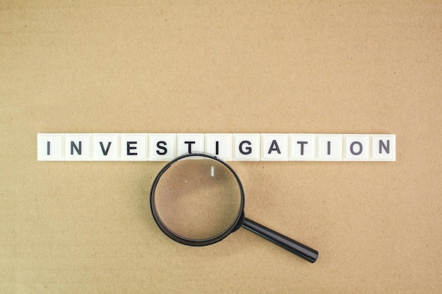 Photo letters of the alphabet with the word investigation. the concept of a spy or the investigation