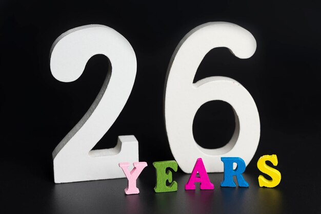 Фото Буквы и цифры двадцать шесть лет на черном фоне