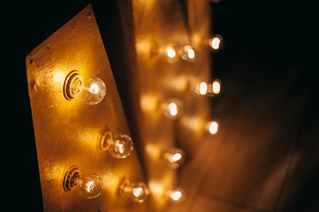 An letters close-up. letters for the sign with the bulbs.
letters an on a yellow light bulb