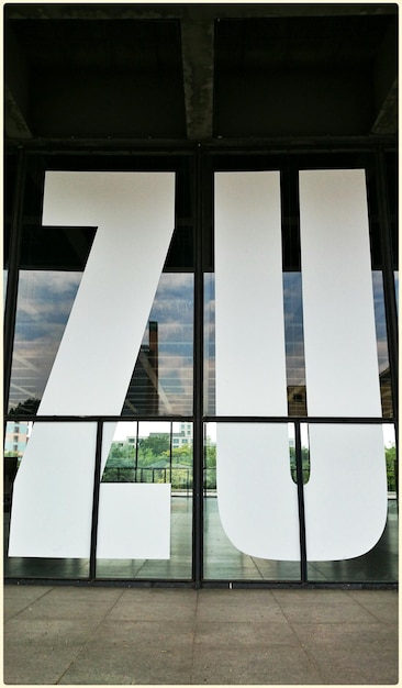 Photo letters on glass of building