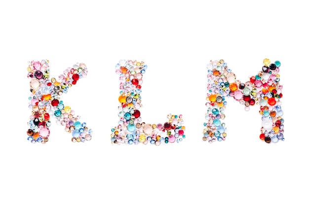 Letters KLM from glass bright gems