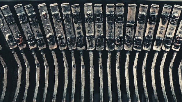 Letters and numbers on typo keys of an old manual typewriter on a retro writing machine close up vie