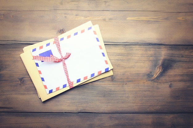 Letters on the old wooden table background