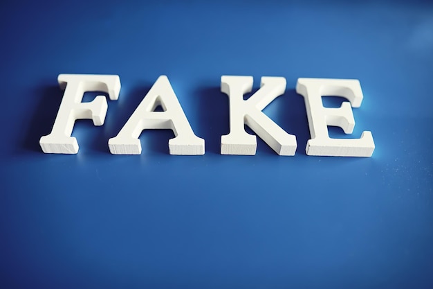 Photo the letters spelled the word fake the concept of modern information technology fake and facts in the news