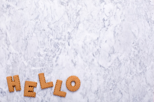 Letters tasy cookies Hello on marble