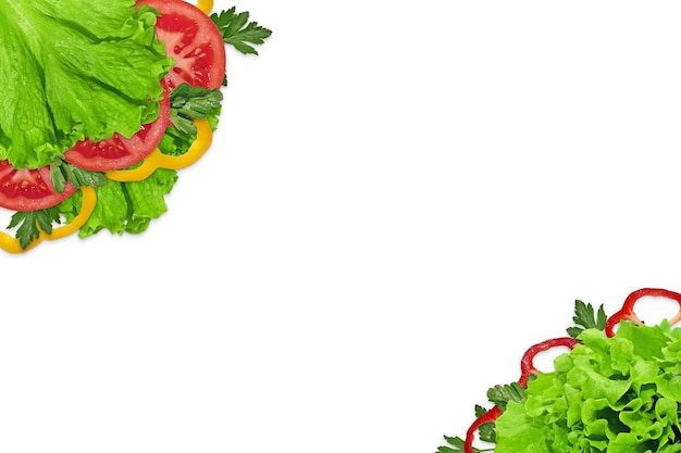 In lettuce leaves are pepper, tomato and parsley. Vegetables on a white background. vegetarian food