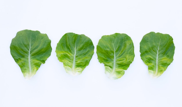 Photo lettuce leaves on white surface