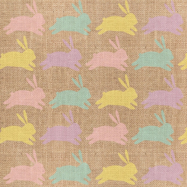 Foto leuke kleurrijke konijnen kleurrijke achtergrond linnen textuur stof