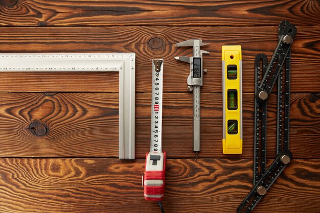 Level and corner, ruler and caliper, top view. Professional measuring instrument, carpenter equipment, woodworker tools