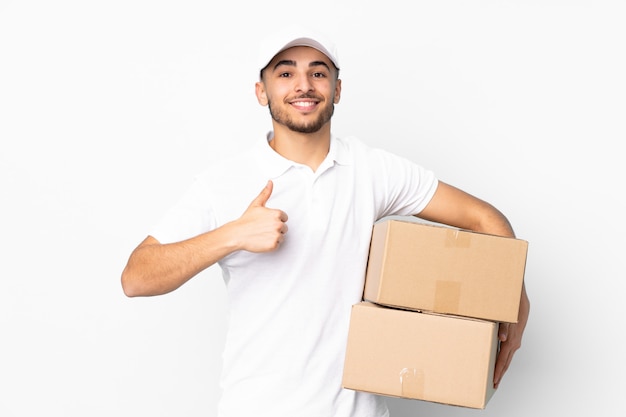 Levering Arabische man op blauwe muur geven een duim omhoog gebaar