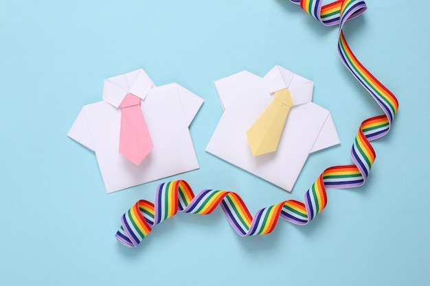 Lgbt community Origami shirts with tie and rainbow ribbon on pink background