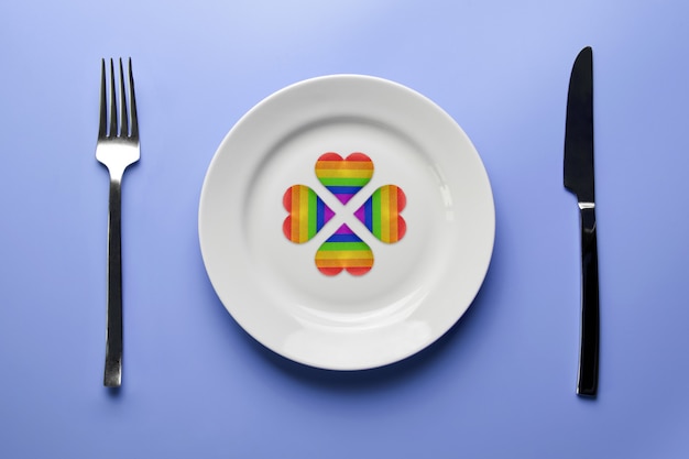 LGBT flag hearts on plate with cutlery