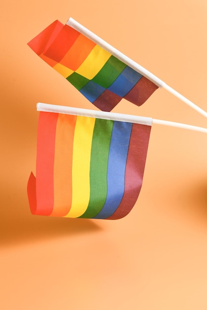LGBT flag on orange background Copy space