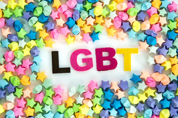 LGBT lettering placed on white background with a colorful star paper craft , diversity LGBT 