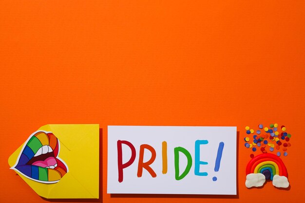 lgbt parade concept symbols on orange background