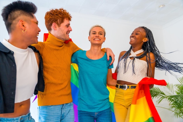 LGBT pride lgbt rainbow flag group of friends dancing and having fun in a house at the party