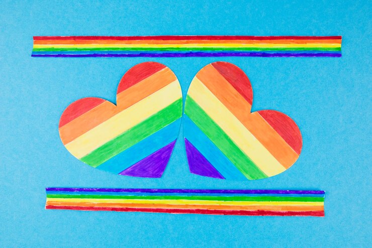 Photo lgbt は、青い背景に 2 つの虹のハートの権利と男女平等をシンボルします。