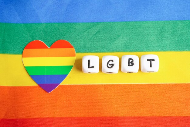 LGBT text character with rainbow flag heart for symbol of pride month lesbian gay bisexual transgender human rights tolerance and peace