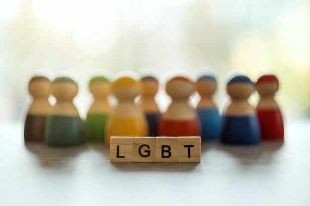 LGBT word on wooden blocks with diverse people in the background