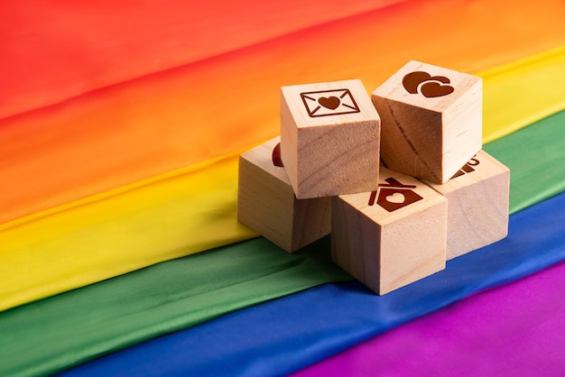 LGBTQ flag and symbol on table top view