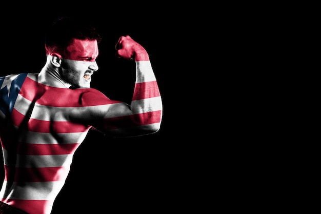 Liberia flag on handsome young muscular man black background