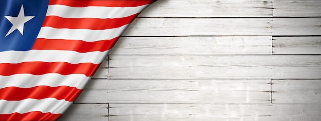 Liberia flag on old white wall.