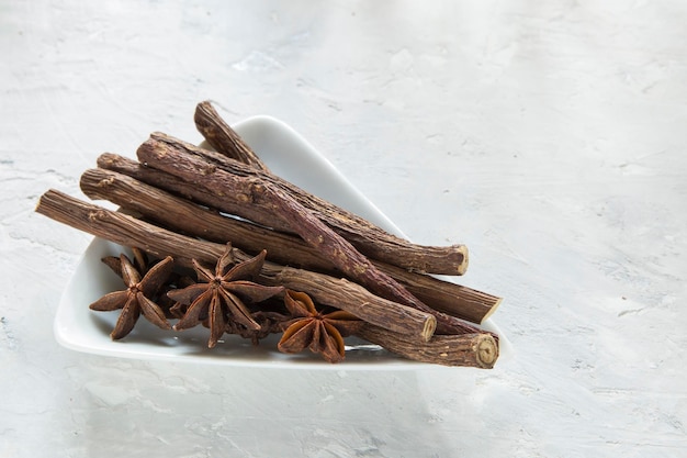 Licorice and anise roots in bowl on the table