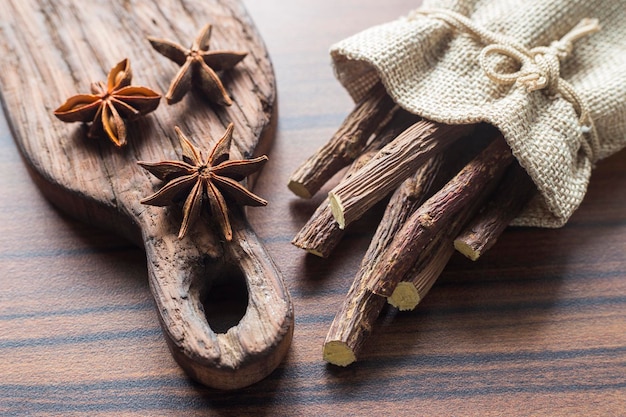 Licorice root and anise on the table Glycyrrhiza glabra