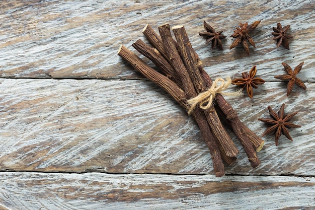 Licorice root and anise on the table Glycyrrhiza glabra