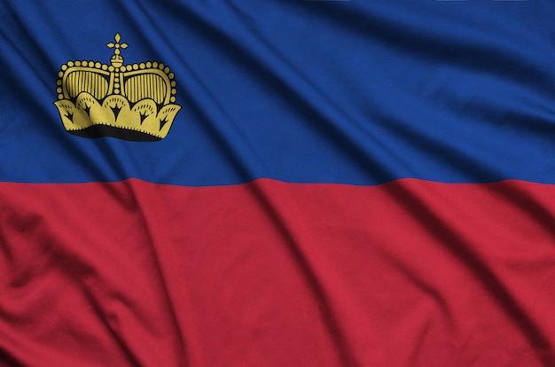 Liechtenstein flag is depicted on a sports cloth fabric with many folds.