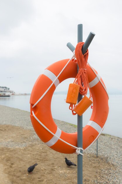 Life buoy attached to a post at the beach