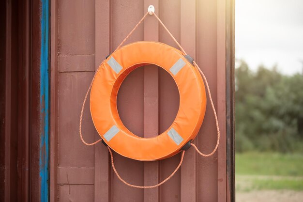 A life buoy is hanging on the door