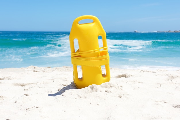 Life buoy in sand at beach