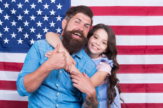 Life liberty and the pursuit of happiness Happy family celebrating independence day on american flag background Happiness day Happiness and americal ideals Pursuing happiness and following dream