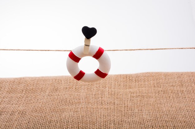 Life preserver attached to a string with heart