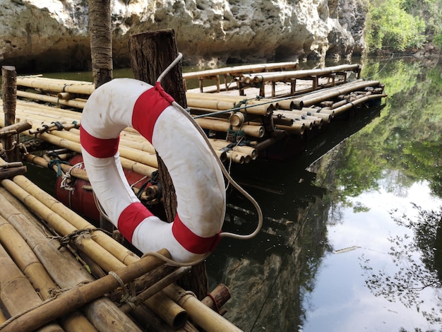 Life saving equipment life rings the rescuer helps a drowning\
person