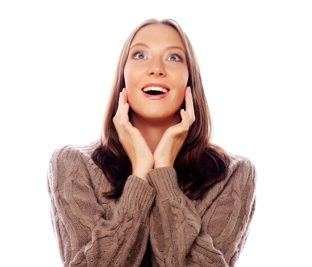 life style happiness emotional and people concept Beautiful young woman looking at camera and make different emotions while standing against white background