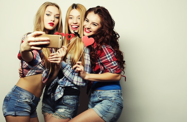 Life style, happiness, emotional and people concept: funny girls, ready for party, selfie