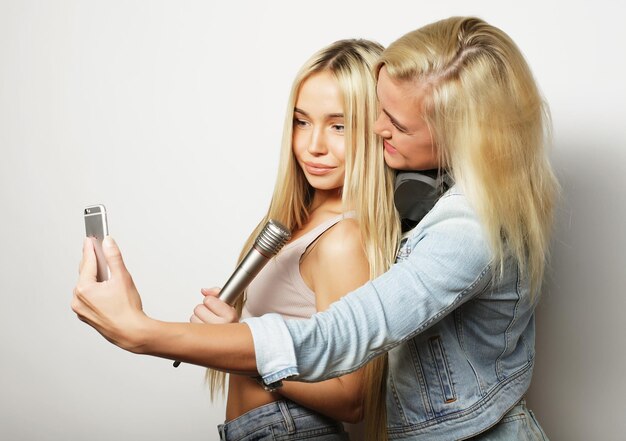 Life style happiness emotional and people concept two hipster girls taking photo Happy selfie