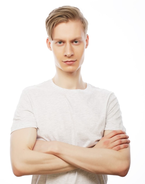 Life style and people concept: handsome man in white shirt, studio shot isolated on white background.