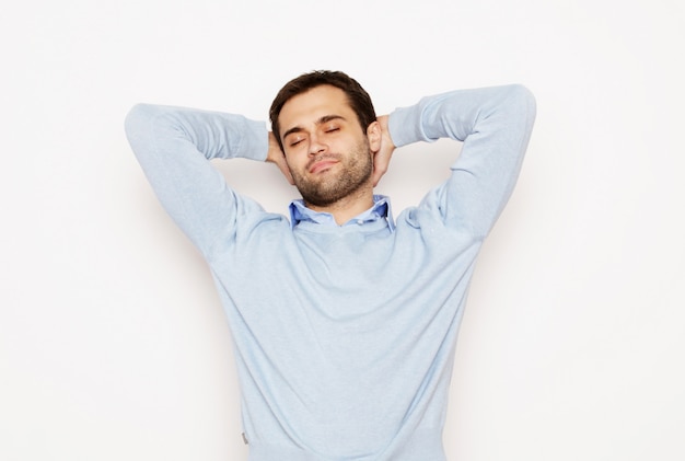 Life style  and people concept: happy young man in blue shirt. Over white space.