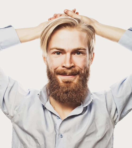 Life style and people concept: young bearded man, casual style, close up. Isolated on white background.