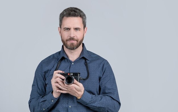 A life well captured Bearded man hold photo camera Photographic equipment Visual art Professional photography Photographic studio copy space