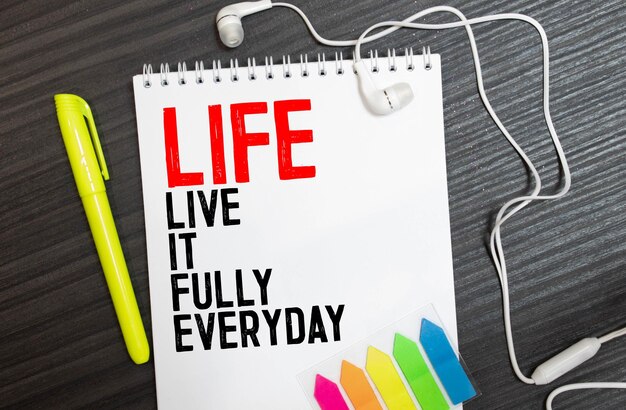 LIFE wooden alphabets on wood background with text acronym Live It Fully Everyday