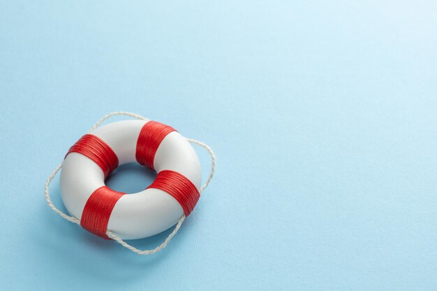 Photo lifebuoy on a blue background template copy space for text